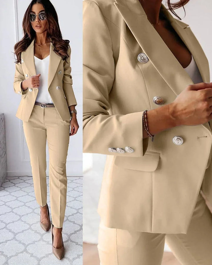 Elegant women's double-breasted suit set, tailored blazer & matching trousers. Perfect for business fashion.