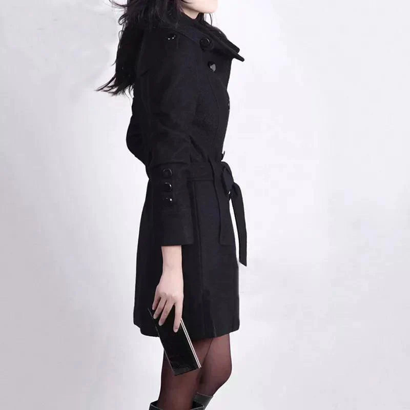 Chic women's trench coat, double-breasted design with a belted waist, ideal for elegant fall & winter outerwear.