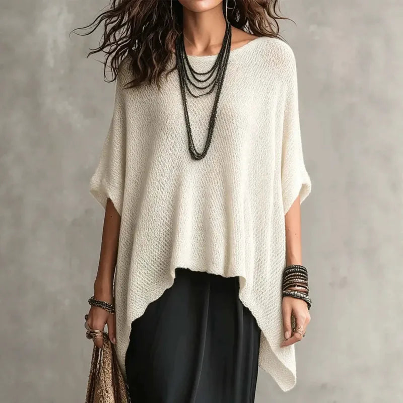 Women's draped boat neck knit poncho top with asymmetrical hem, ideal for elegant casual wear & layering.