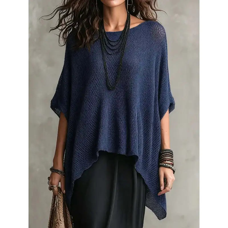 Relaxed fit women's textured knit poncho blouse; elegant boat neck & flowing drape, perfect pullover for casual style.