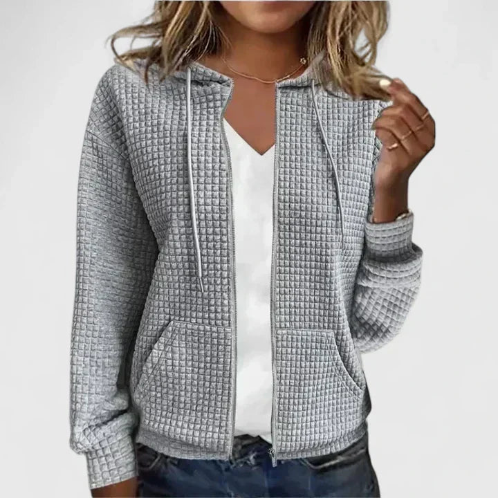 Chic women's open front cardigan, featuring a comfortable drape and elegant long sleeves for layering.