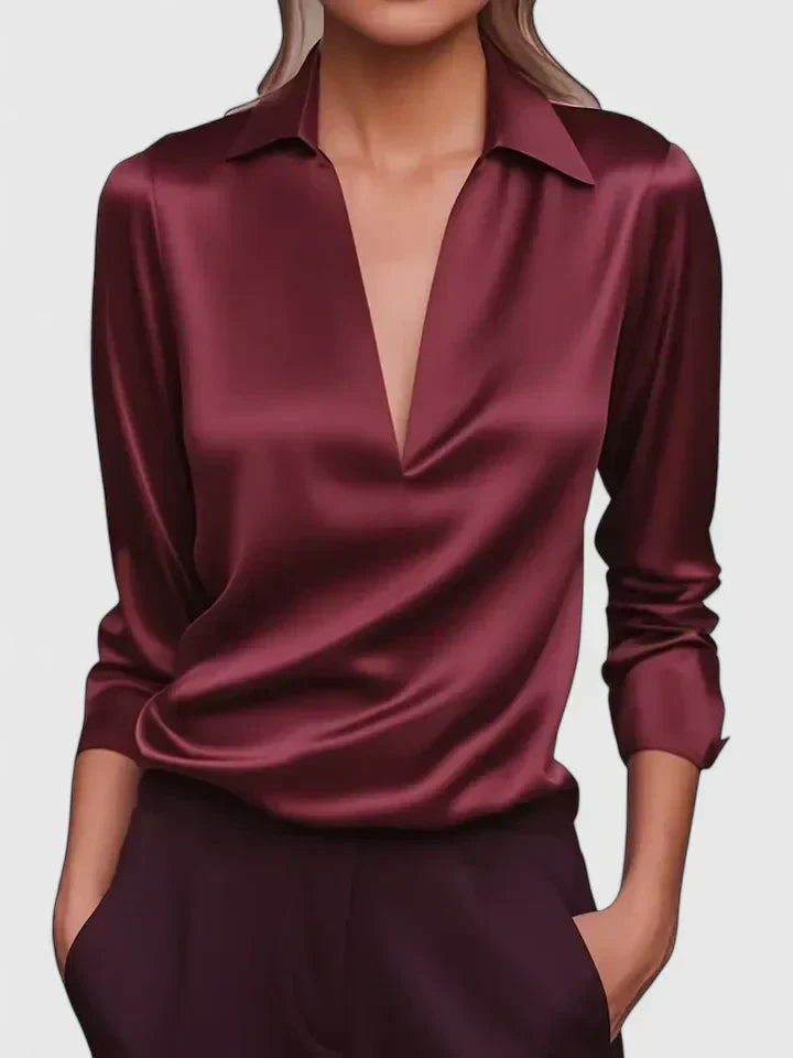 Chic women's V-neck long sleeve blouse with a draped fit. Versatile for workwear or evening events.