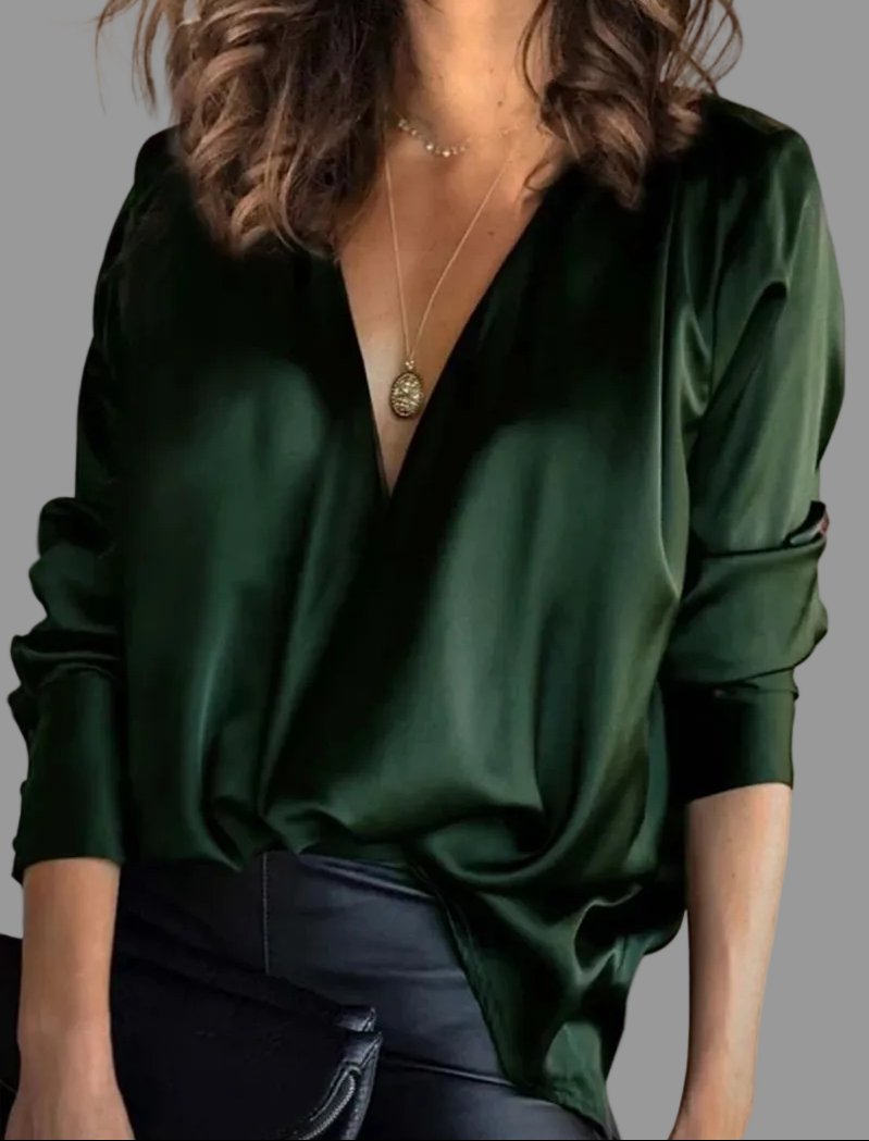 Women's draped V-neck relaxed fit blouse with long sleeves, perfect for elegant evening wear.