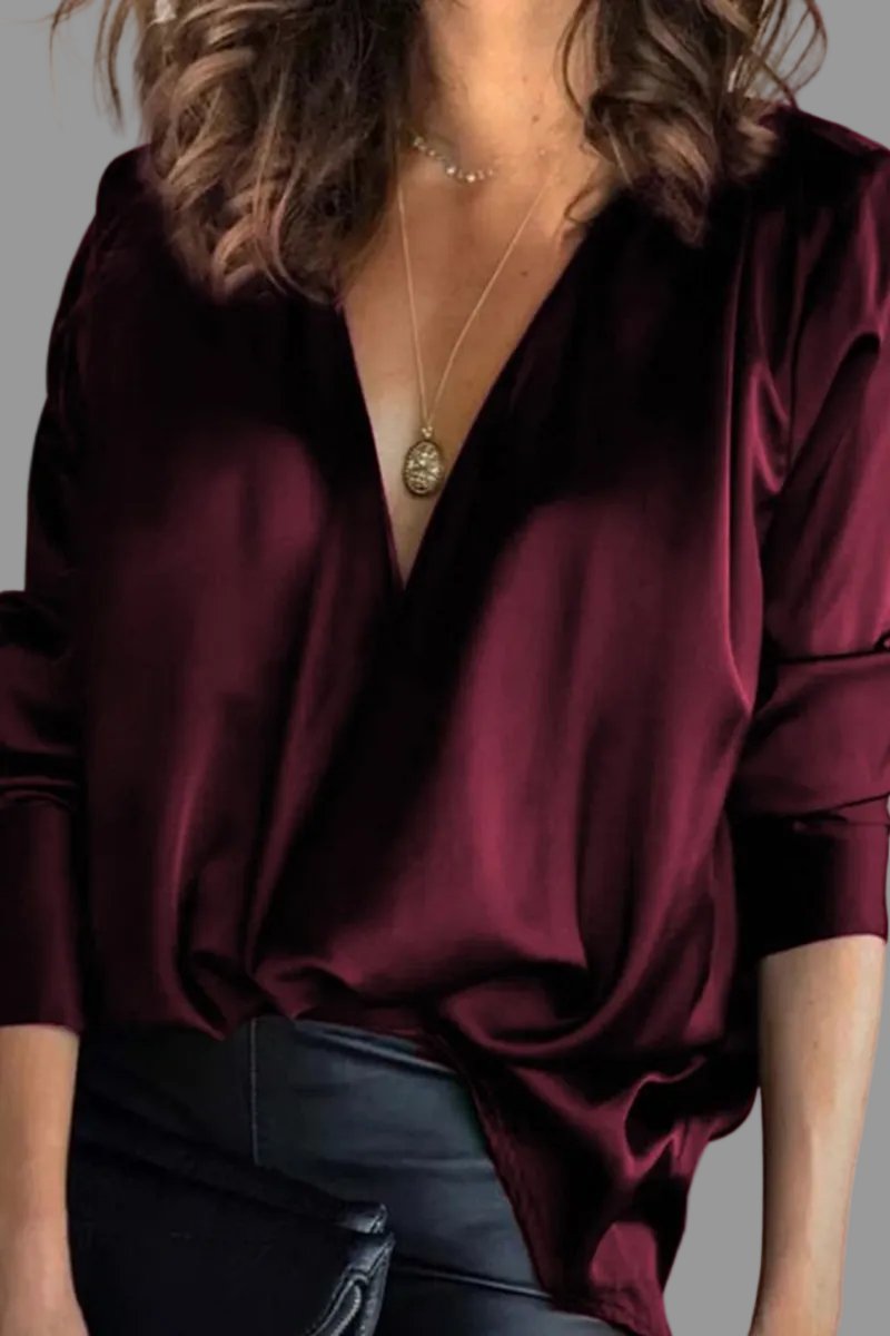 Elegant women's shimmer blouse, draped V-neck & relaxed fit, ideal for party or evening wear.
