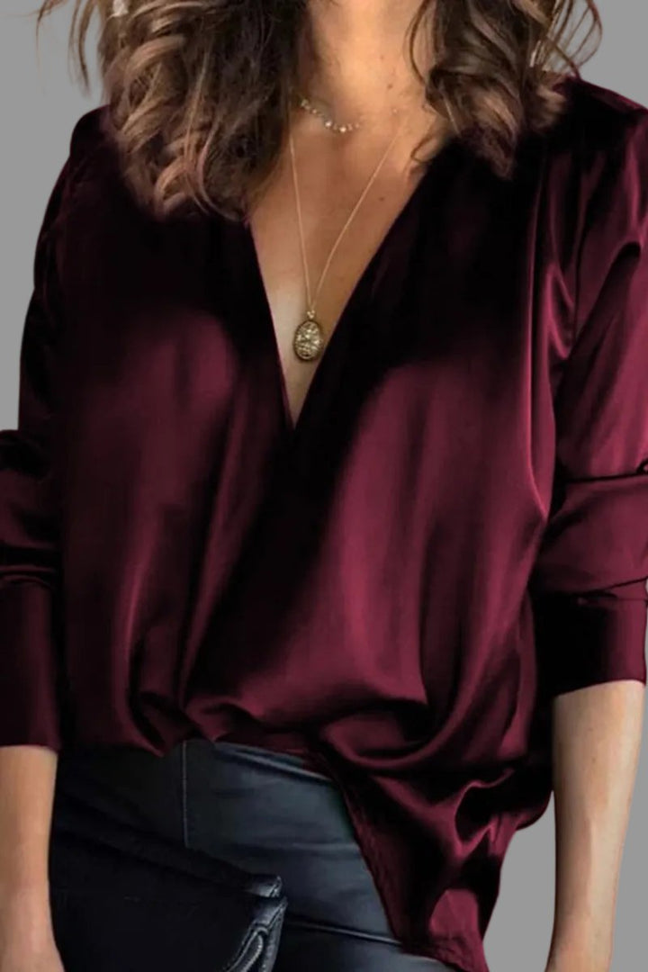 Elegant women's shimmer blouse, draped V-neck & relaxed fit, ideal for party or evening wear.