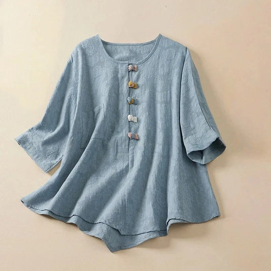 Women's Eden Blouse: elegant long sleeve top, draped fit, unique knotted buttons, versatile spring & summer fashion.