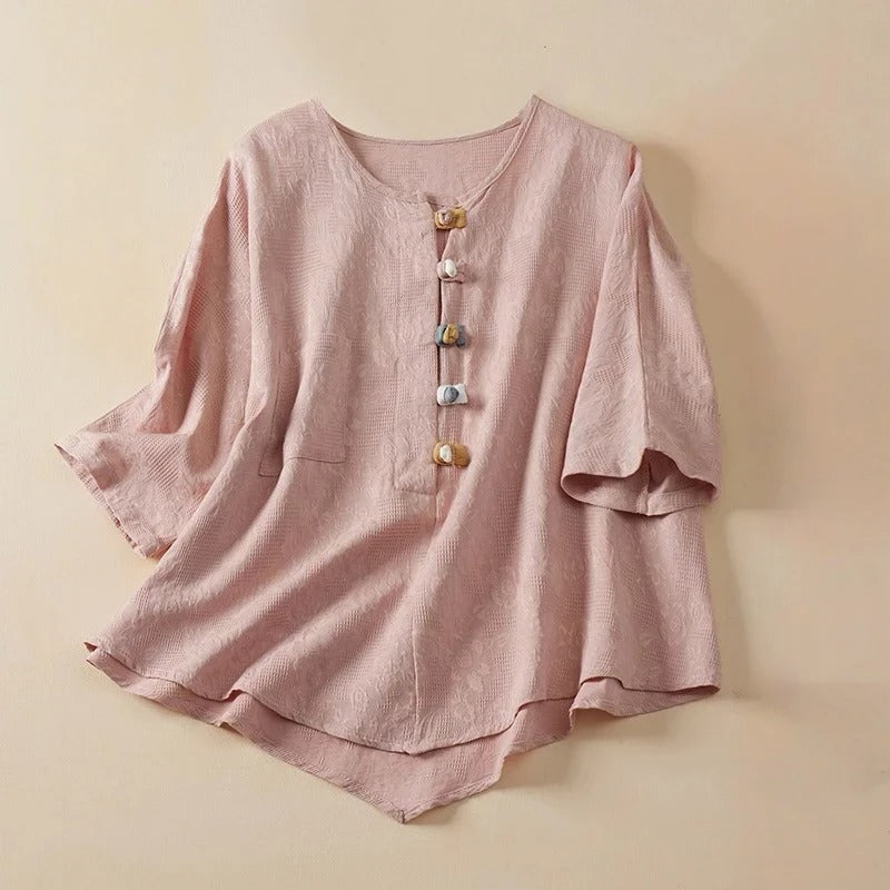 Casual chic women's Eden Blouse with stylish knotted buttons. Perfect button-up shirt for versatile wear.