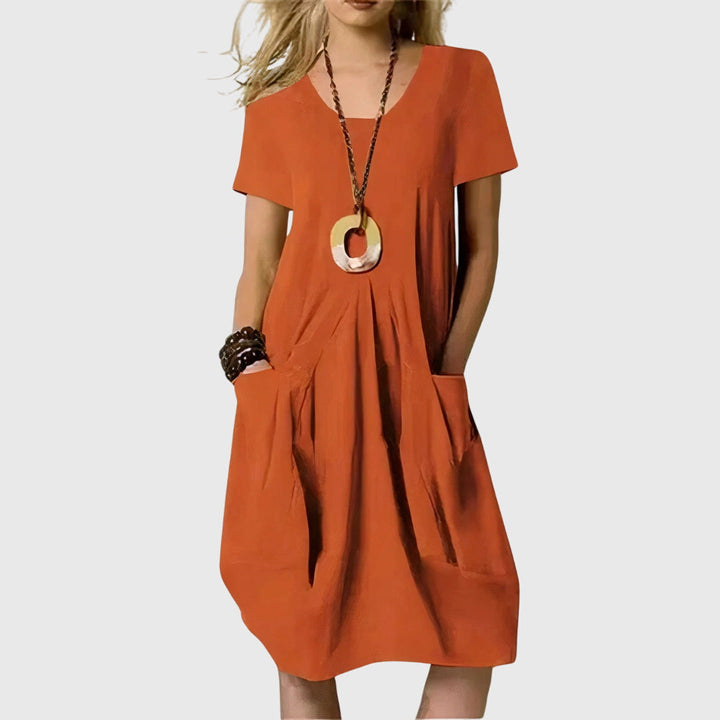 Women's effortless A-line casual dress with practical pockets. Perfect for everyday versatile wear.