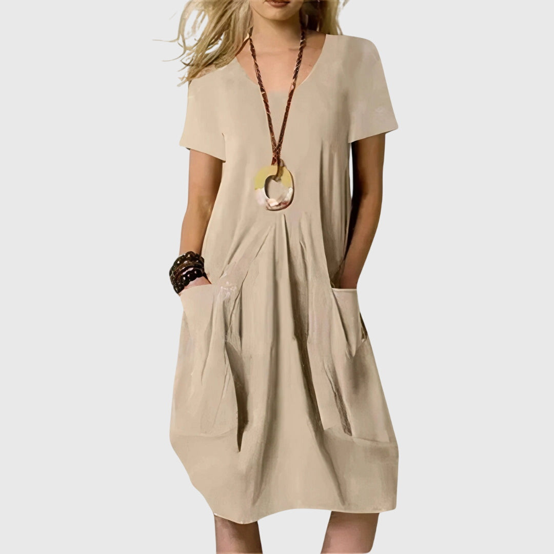 Stylish women's A-line dress with pockets. Perfect for casual spring and summer fashion. Effortlessly comfortable.