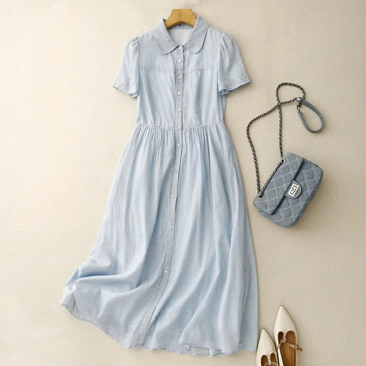 Women's effortless button-front midi summer dress in flowy fabric. Perfect casual day or vacation wear with a round collar.