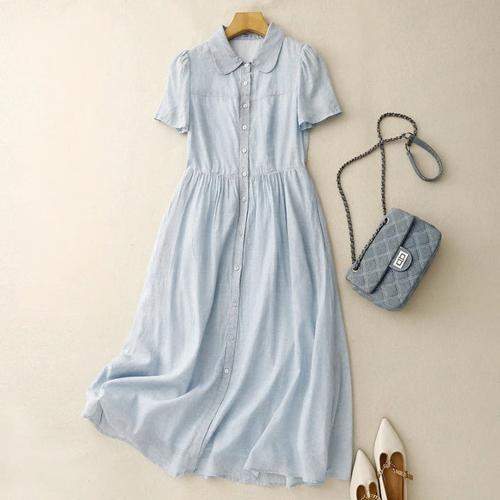 Women's effortless button-front midi summer dress in flowy fabric. Perfect casual day or vacation wear with a round collar.