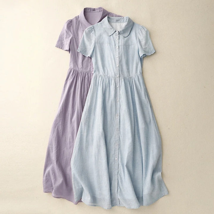 Lightweight women's casual button-front summer dress. Flowy midi style with round collar, great for warm days & vacation.
