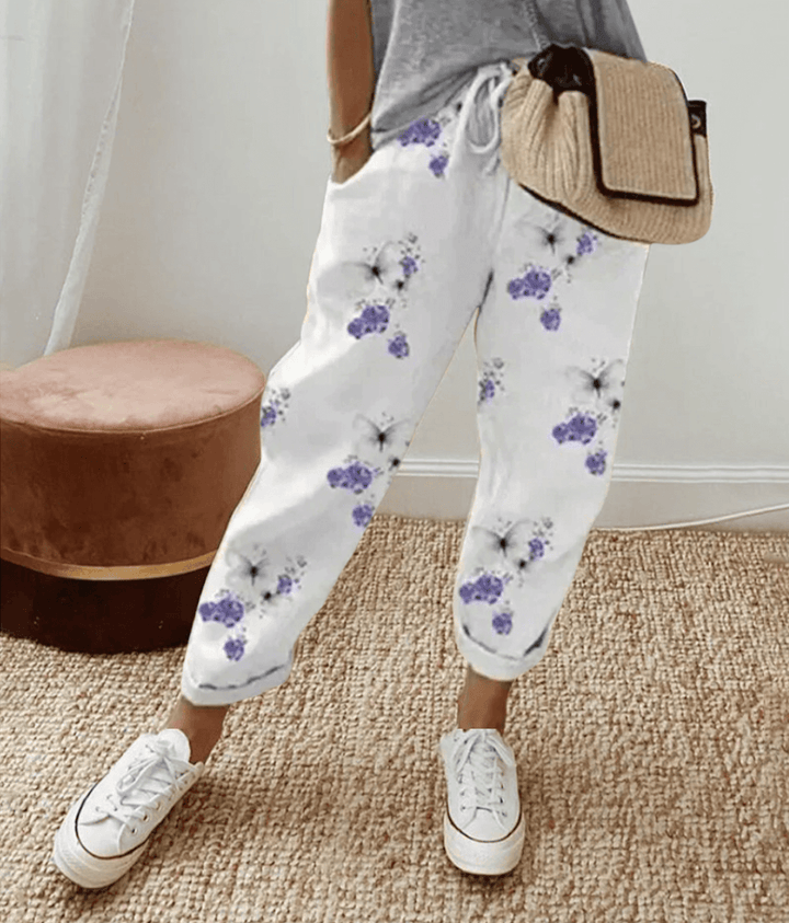 Women's khaki striped trousers with a flattering fit, ideal for chic casual wear & versatile spring/summer styles.