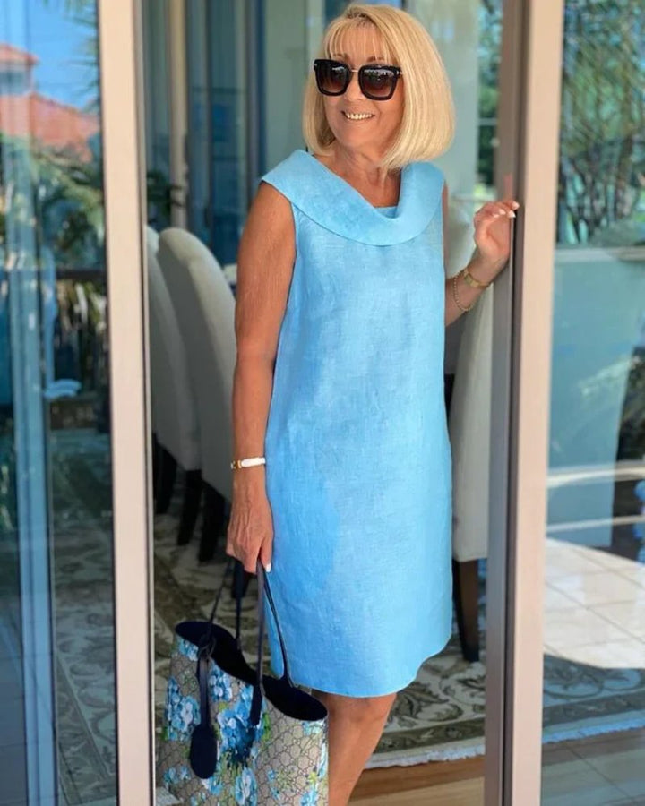 Sleeveless casual shift dress with cowl neck, perfect for summer brunches, vacations, or everyday comfort.