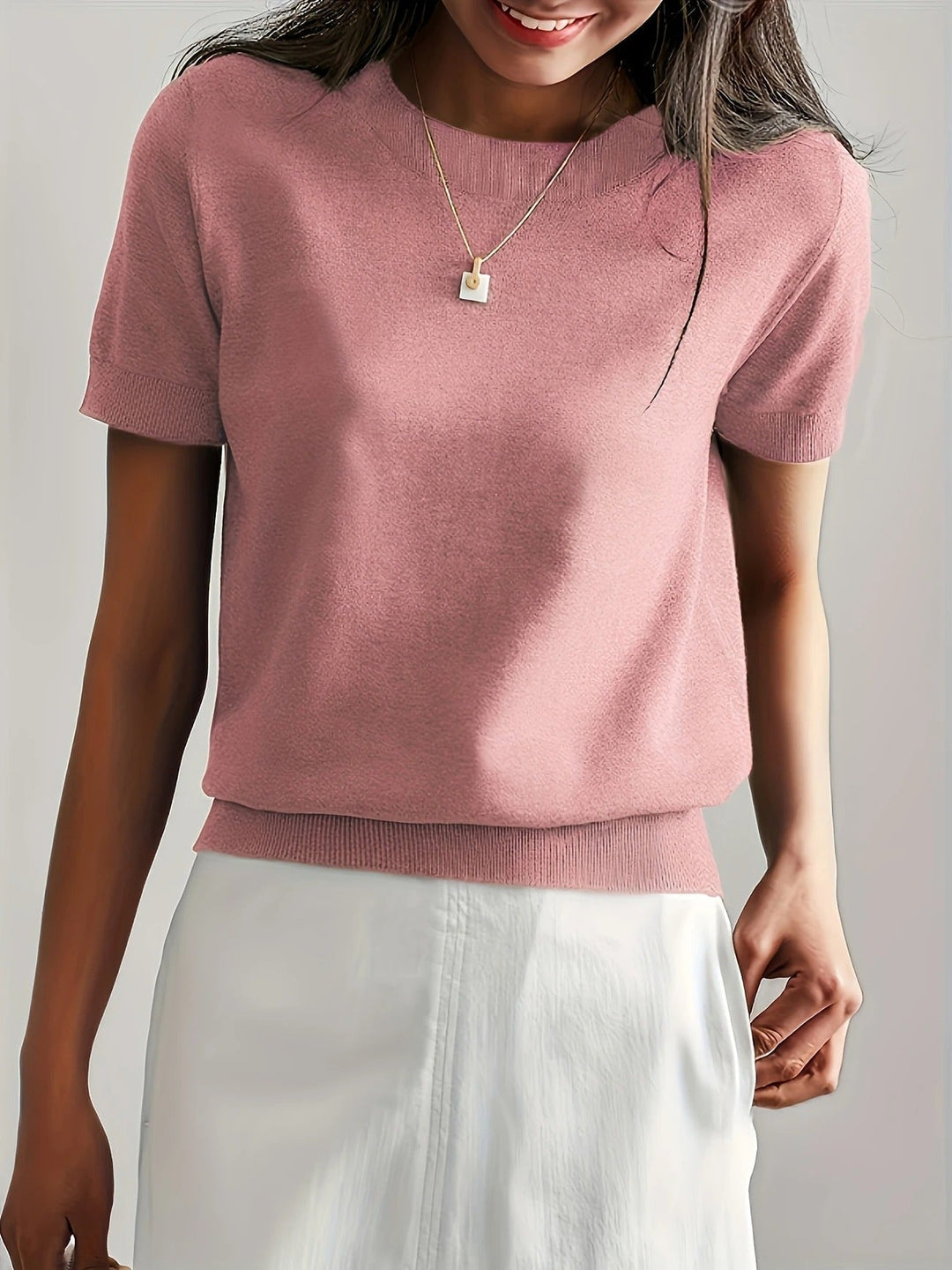 Women's versatile crew neck knit tee with short sleeves. Essential for effortless style.