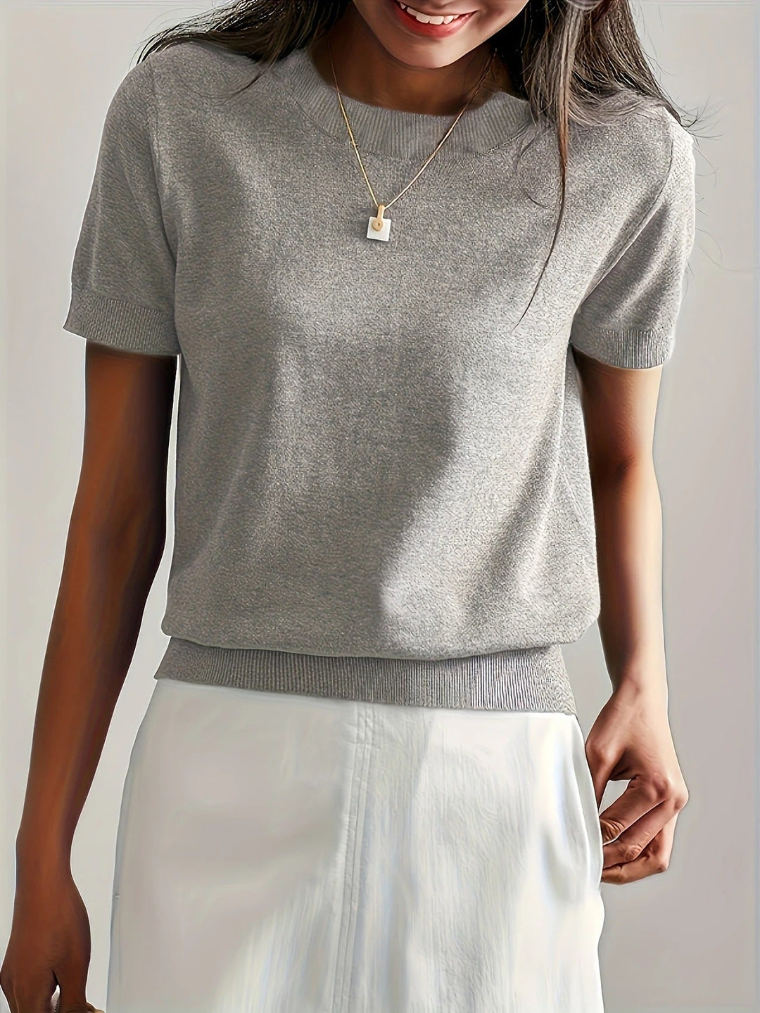 Elevated basic women's knit tee, short sleeve, crew neck. A must-have relaxed fit top.