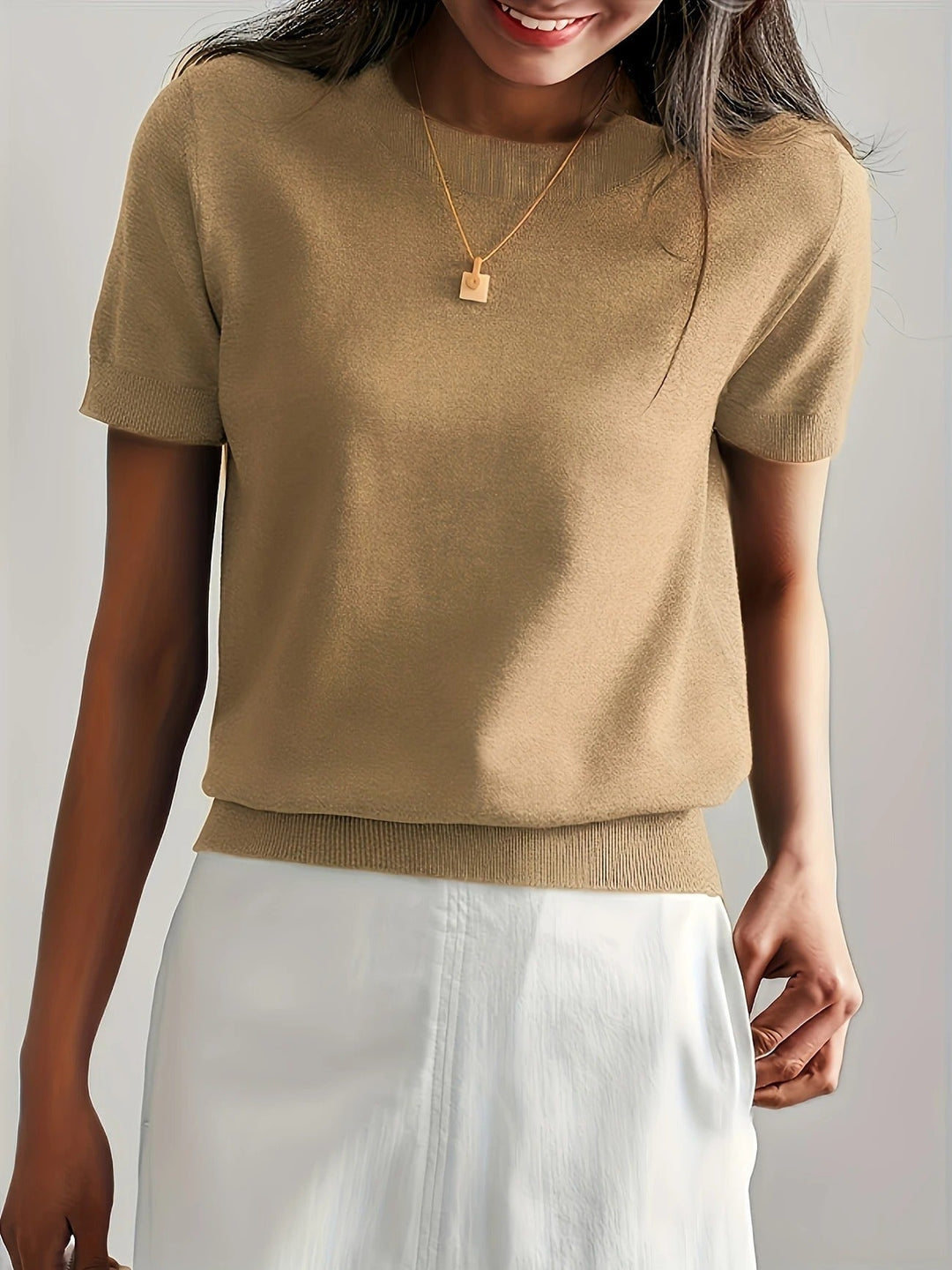 Simple women's crew neck knit tee with short sleeves. A versatile top for any casual outfit.