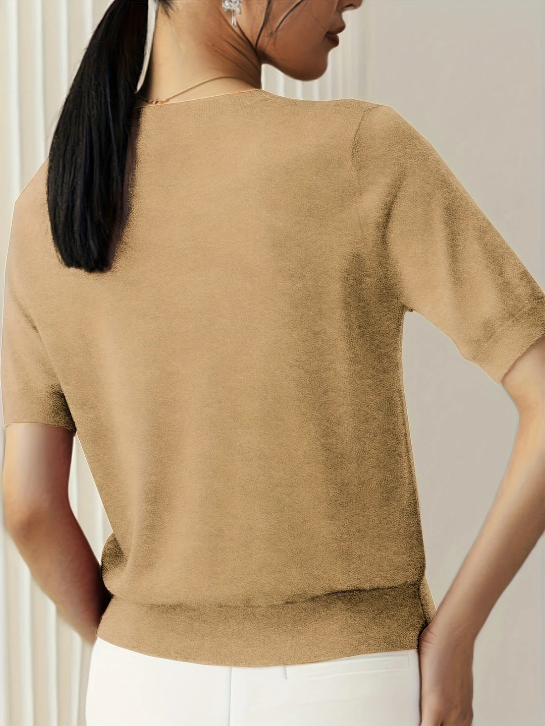 Fashion-forward women's short sleeve knit tee, crew neck. Perfect for an elevated casual ensemble.