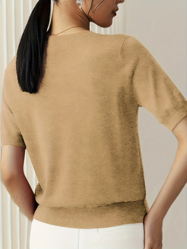 Fashion-forward women's short sleeve knit tee, crew neck. Perfect for an elevated casual ensemble.