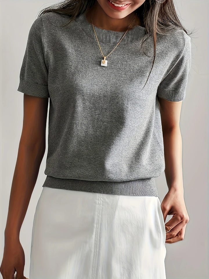 Basic women's short sleeve crew neck knit tee. A versatile top for elevated casual wear.