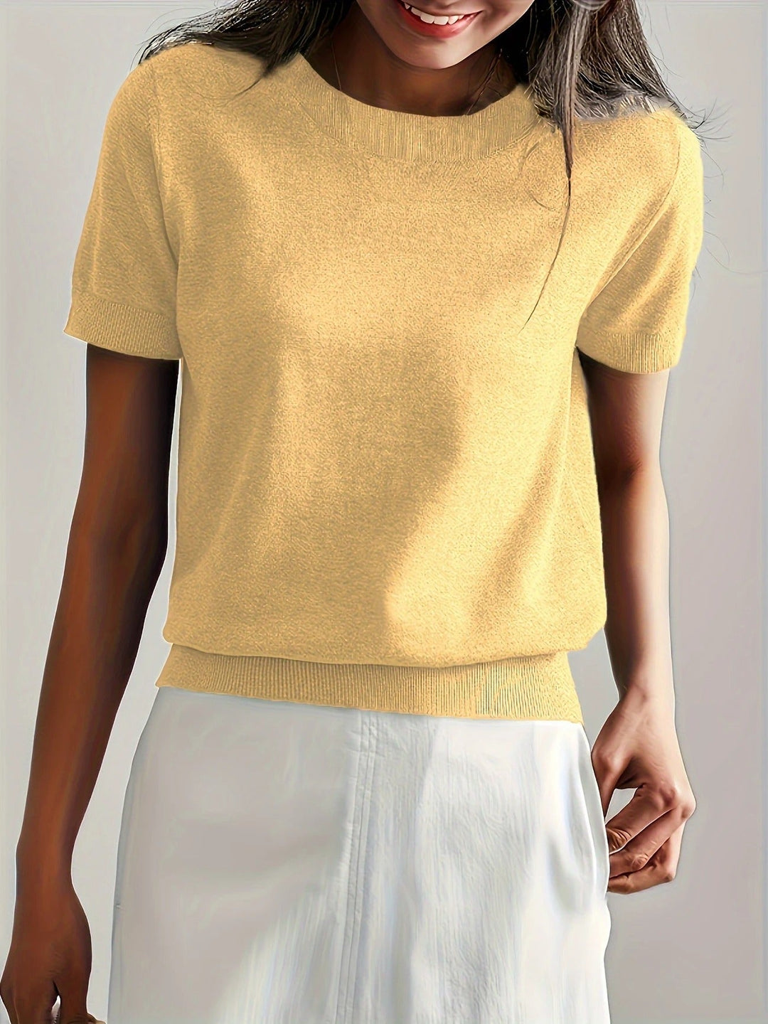 Versatile women's short sleeve crew neck knit tee. An effortless top for daily fashion.