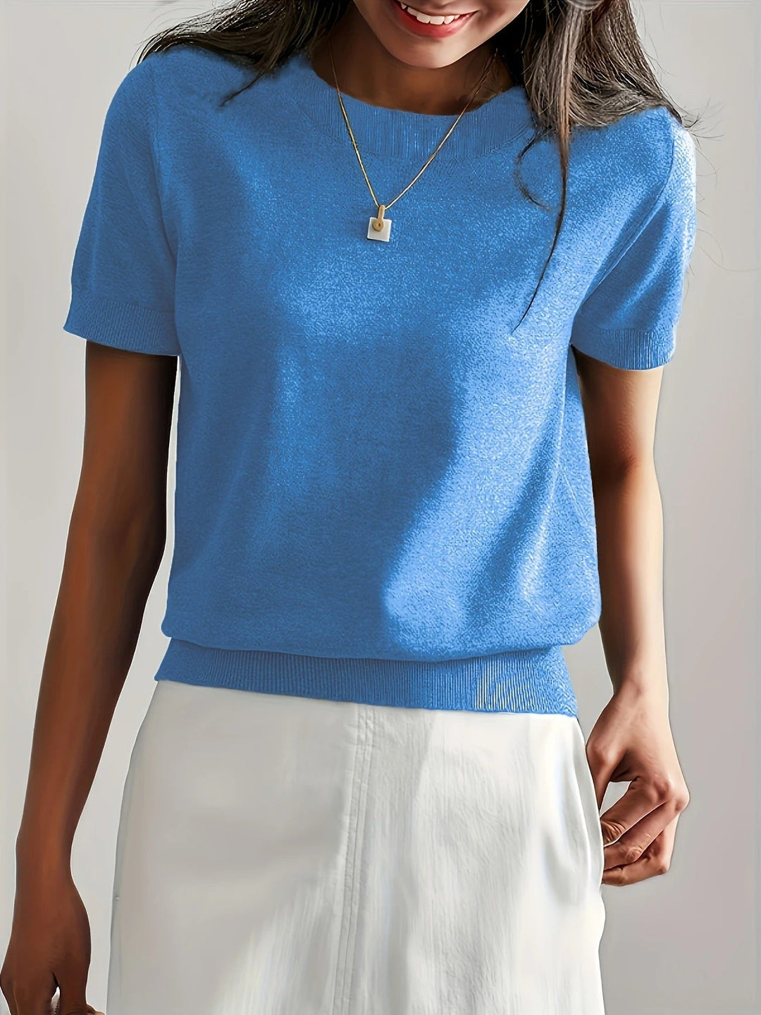 Chic women's knit tee, short sleeve, crew neck. Relaxed fit for comfortable and stylish wear.