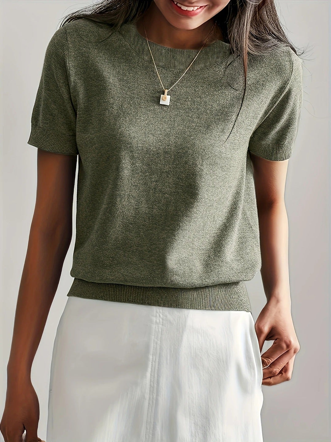 Versatile women's short sleeve knit tee, crew neck. Ideal for everyday wear and elevated style.