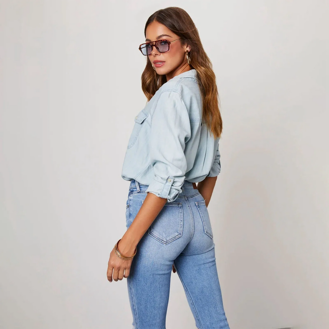 Women's Effortless Denim Button-Up Shirt. Long-sleeve, relaxed fit, perfect for casual and versatile styling.