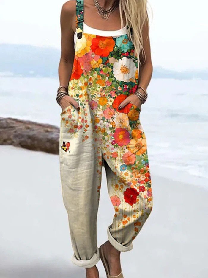 Women's effortless floral wide-leg sleeveless jumpsuit in a vibrant multicolour print, ideal for summer fashion.