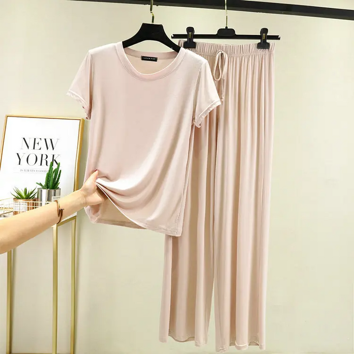 Woman in a comfortable women's lounge set, showcasing the relaxed fit and elegant loungewear style.