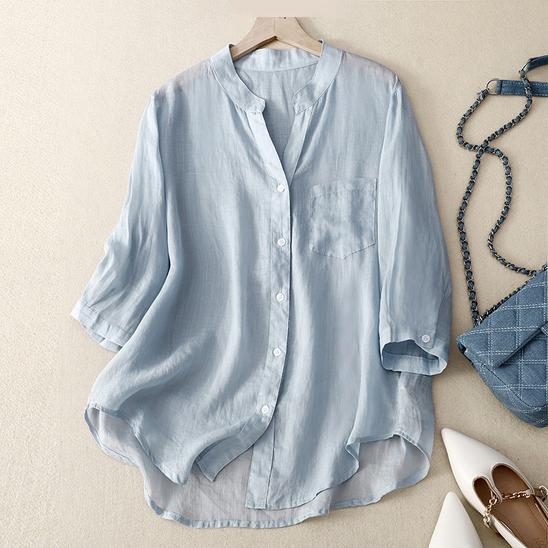 Women's effortless flowy sky blue button-down shirt, perfect for comfortable, relaxed everyday style.