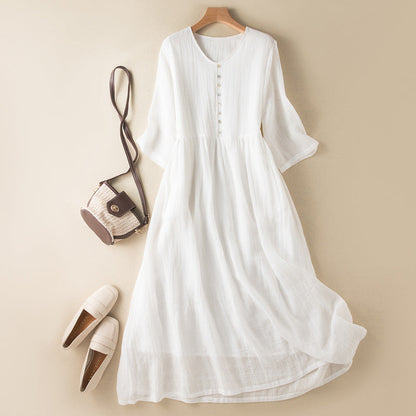 White women's elegant flowy summer dress, versatile for parties or day outings, comfortable and chic sleeveless style.