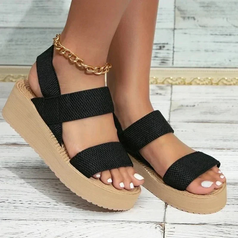 Lightweight women's open-toe flat sandals. Ideal for summer vacations & beachwear, offering all-day comfort.