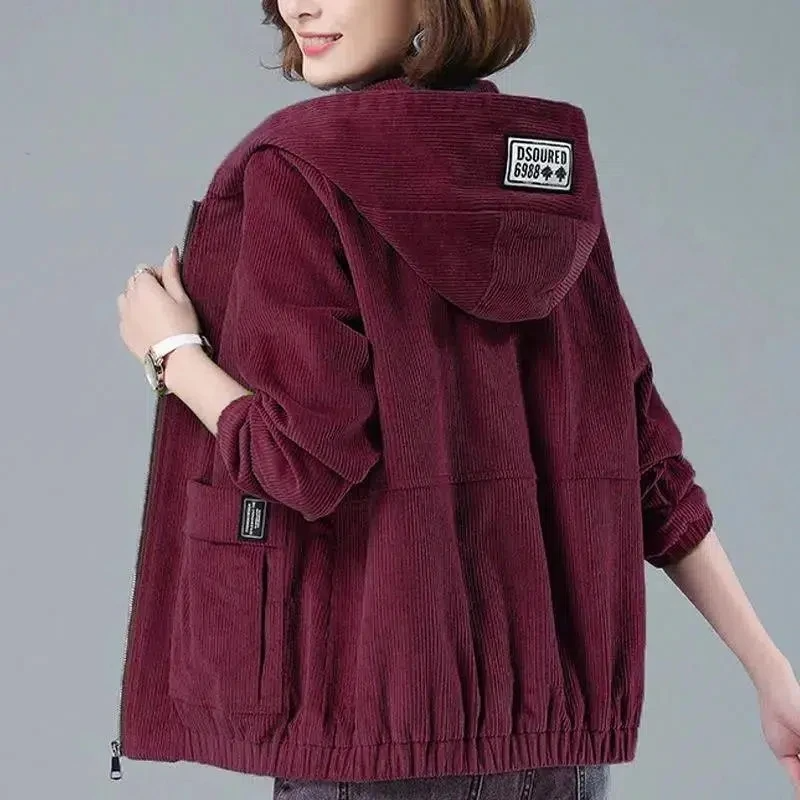 Woman wearing a relaxed fit casual hooded jacket, perfect lightweight outerwear for effortless all-season layering.