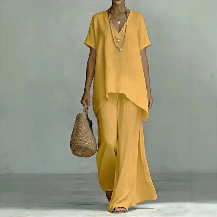 Chic women's linen two-piece set, showcasing an asymmetrical top & comfortable wide-leg pants for summer style.