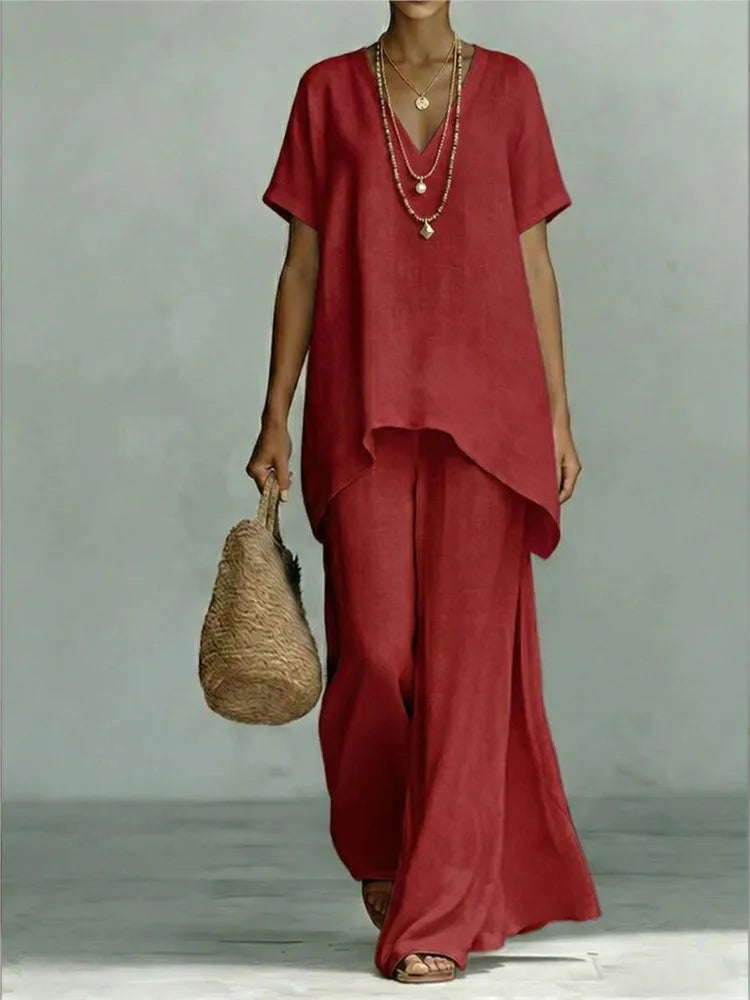 Full shot of women's linen two-piece set, perfect summer lounge wear with wide-leg pants & an asymmetrical top.