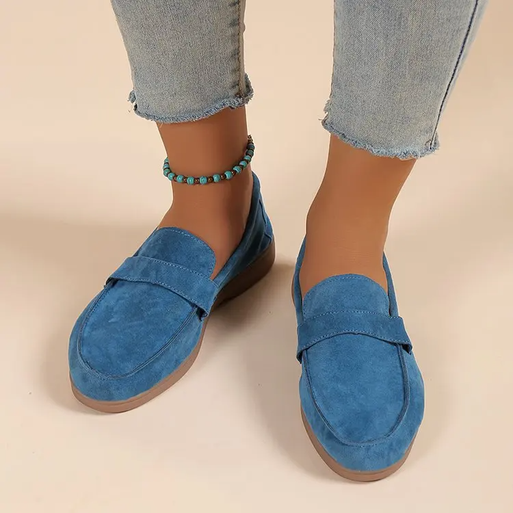 Polished green women's loafers, offering cushioned support and effortless slip-on convenience.