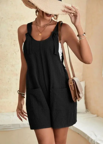 Comfortable one-piece women's romper with adjustable tie straps, perfect for vacation or summer lounge wear.