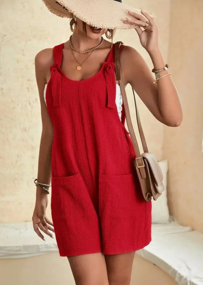 Versatile women's romper, adjustable tie straps, a comfortable one-piece for lounging or casual summer outings.