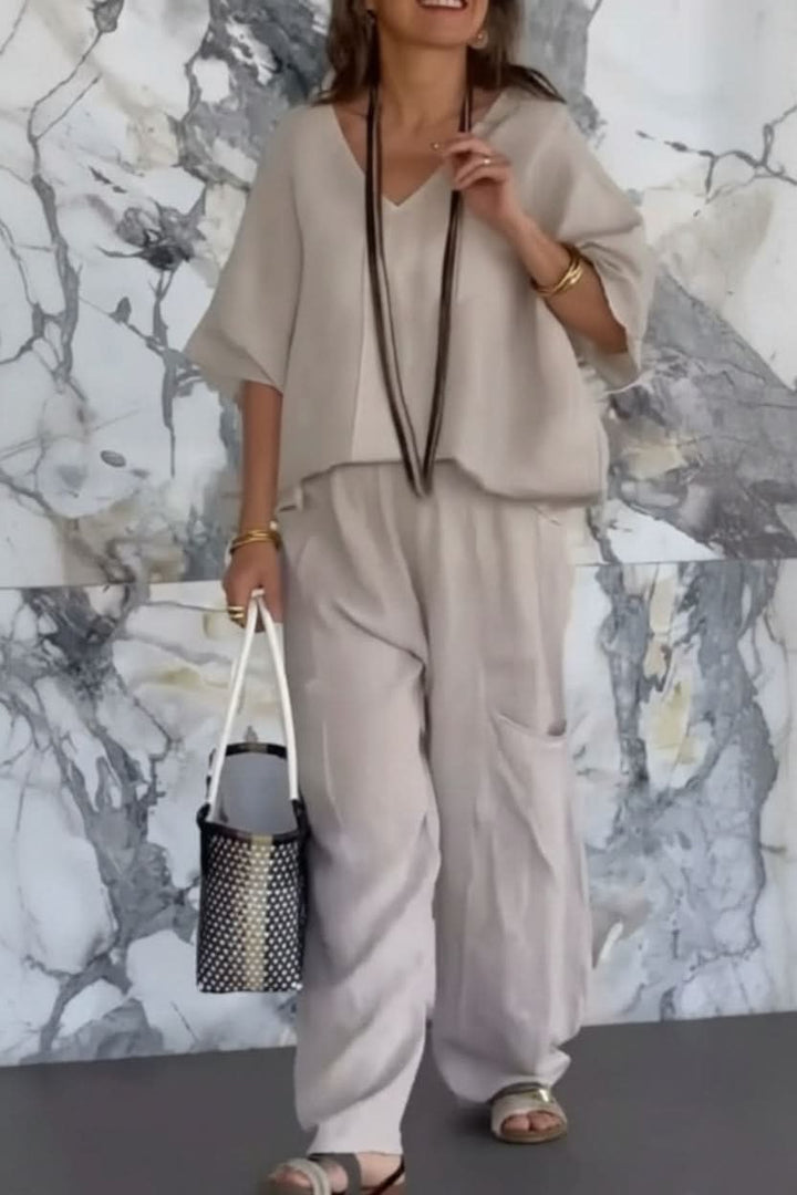 Elegant women's open back pantsuit, a relaxed fit two-piece set ideal for summer travel and casual outfits.