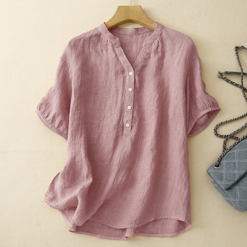 Women's effortless pink V-neck blouse, relaxed fit, perfect for casual spring or summer wear. Elegant long sleeve top.