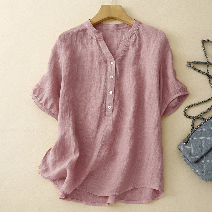Women's effortless pink V-neck blouse, relaxed fit, perfect for casual spring or summer wear. Elegant long sleeve top.