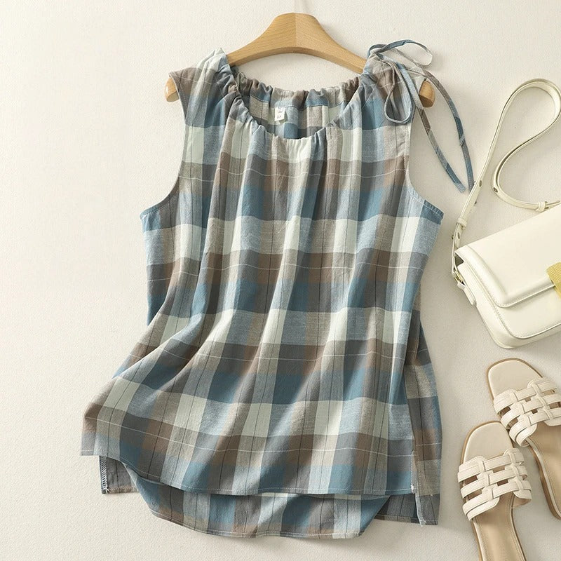 Checked sleeveless top for women with stylish tie neck. Ideal for warm weather and relaxed summer outfits.