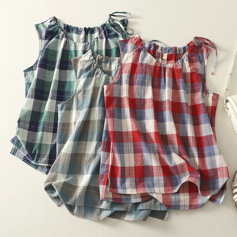 Effortless women's sleeveless top featuring a tie neck. Relaxed fit for comfortable, fashionable summer style.
