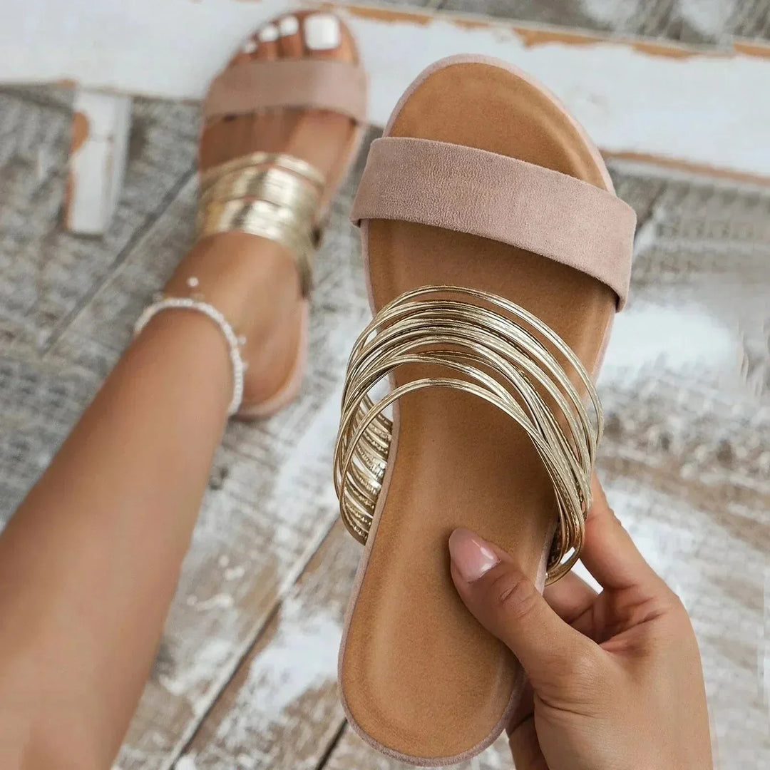 Chic women's strappy slip-on flat sandals, great for effortless style & summer comfort.