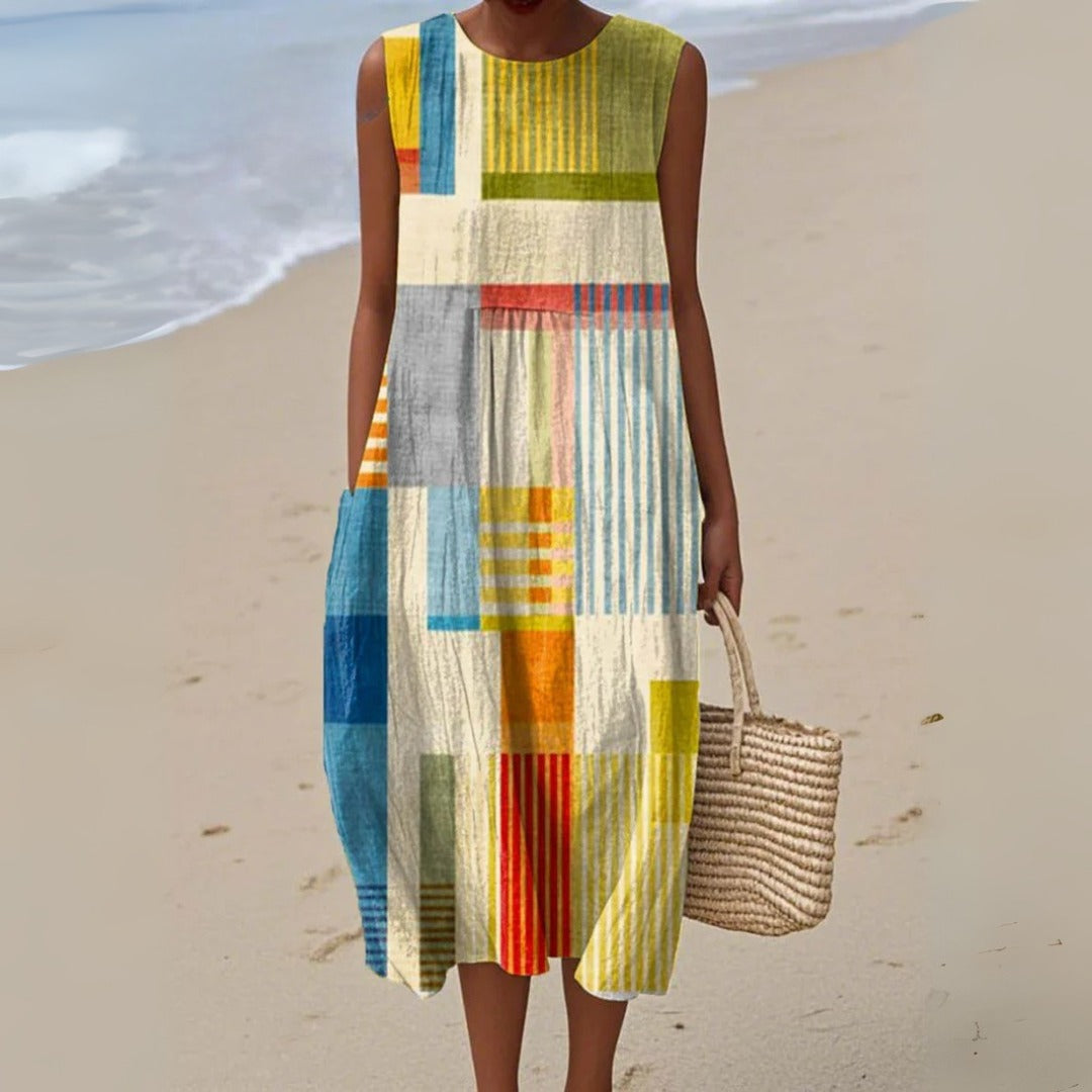 Women's effortless striped patchwork midi dress with pockets. Sleeveless casual summer day dress for comfort.