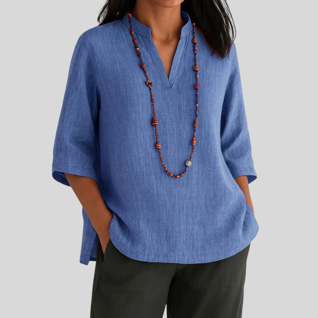 Stylish women's V-neck 3/4 sleeve blouse; comfortable, solid color for work, vacation, or everyday fashion.