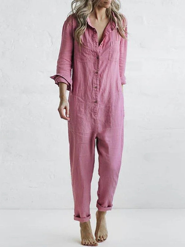 Detailed shot of women's long sleeve button-up jumpsuit. Features a relaxed fit and comfortable design.
