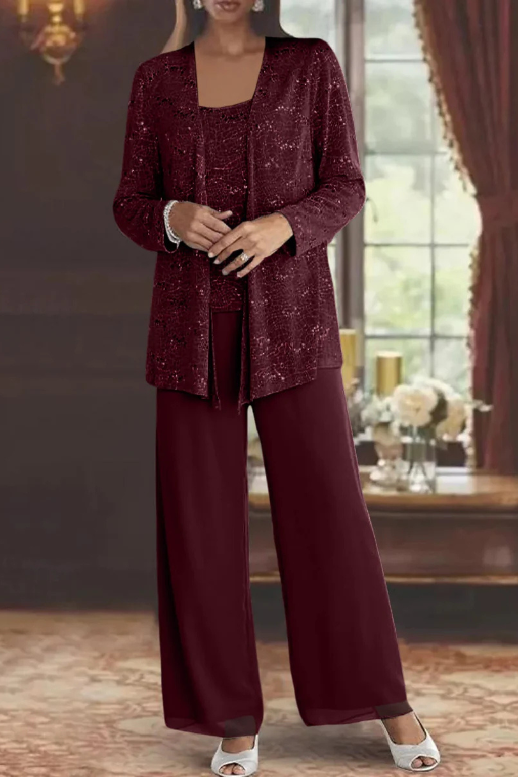 Stylish women's three-piece formal evening wear, showcasing a beautiful flowing silhouette.