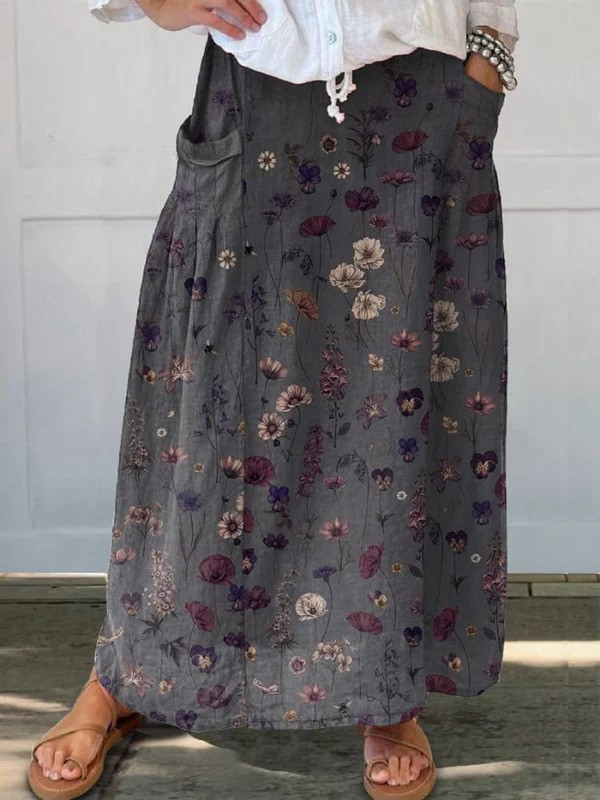 Women's elegant A-line flower art print midi skirt with pockets, perfect for spring/summer versatile style.